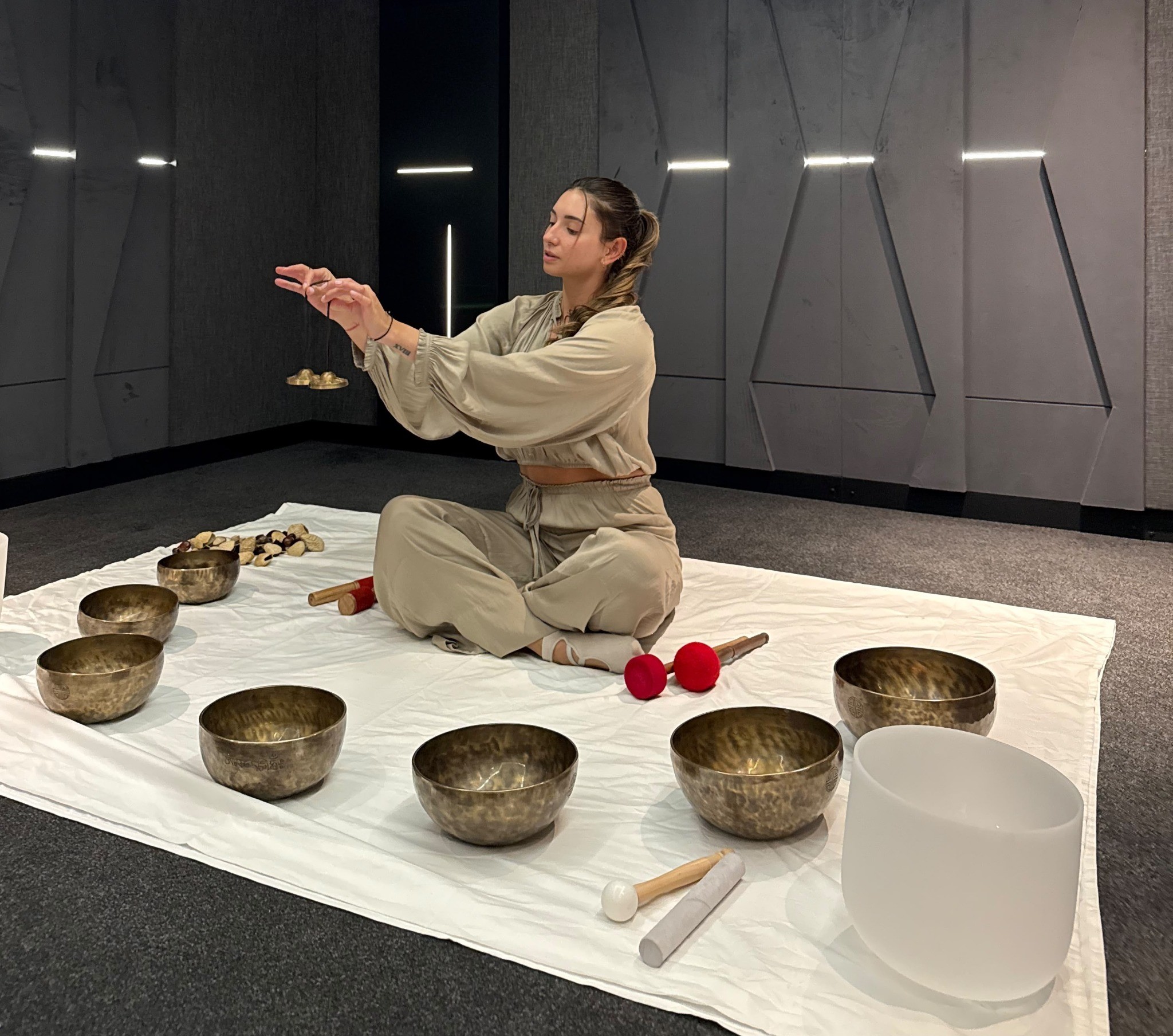 Olivia facilitating sound healing with Tibetan singing bowls